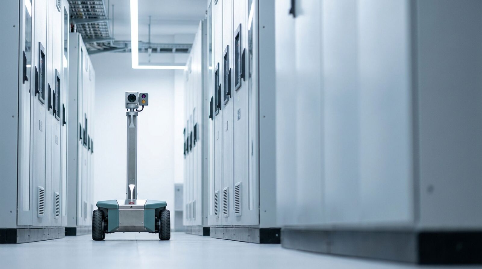 An autonomous inspection robot with a camera mast in a data center electrical aisle